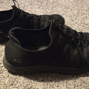 Skechers All-Black Knit Slip-On Sneakers